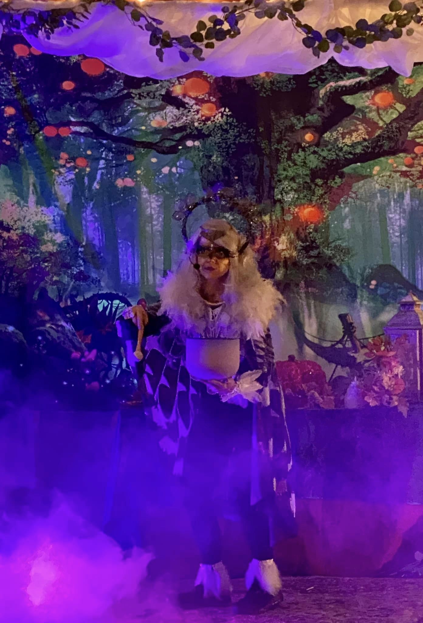 Outdoor sound healing at a festival with participants resting on the grass
