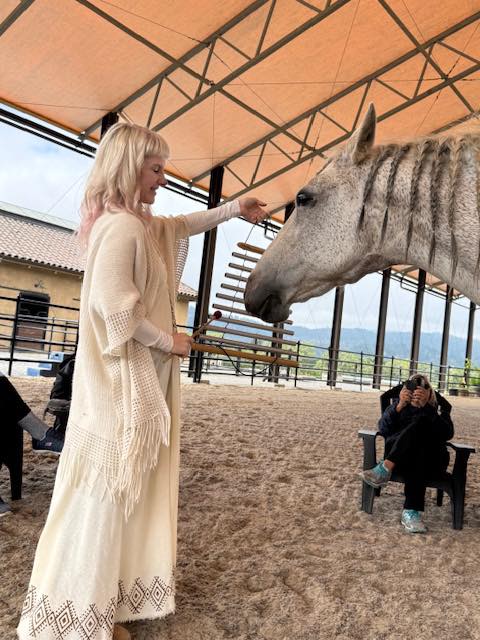 Chris in a healing moment with a horse during an immersive event